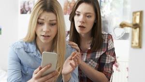 Teenager checking her cell phone
